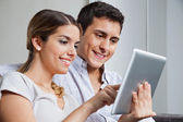 depositphotos_Young-couple-with-tablet-pc image